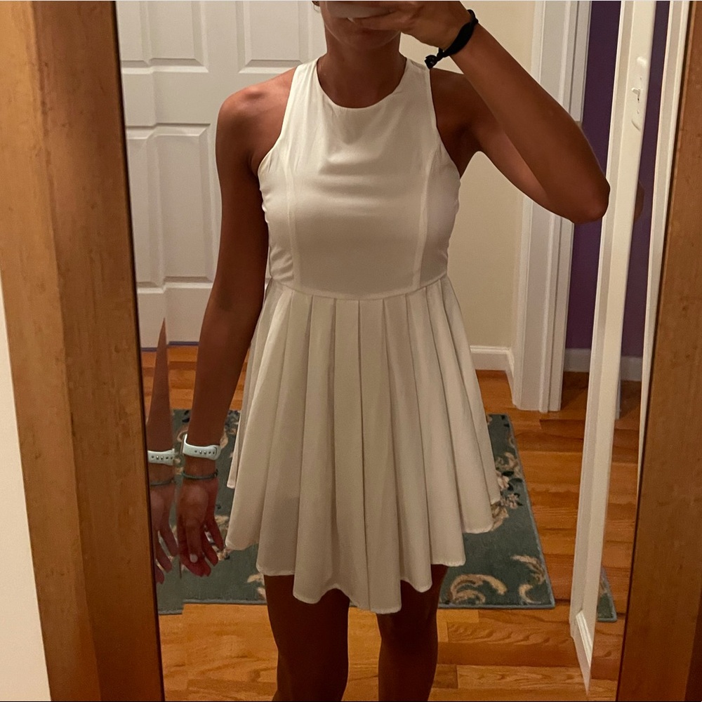 White pleated flounce dress